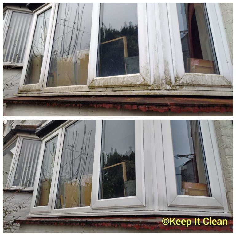 A person using a pressure washer to clean a patio surface.